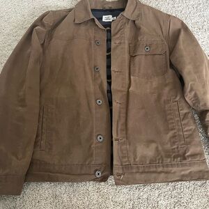 Men's Flint & Tinder flannel lined waxed trucker jacket.